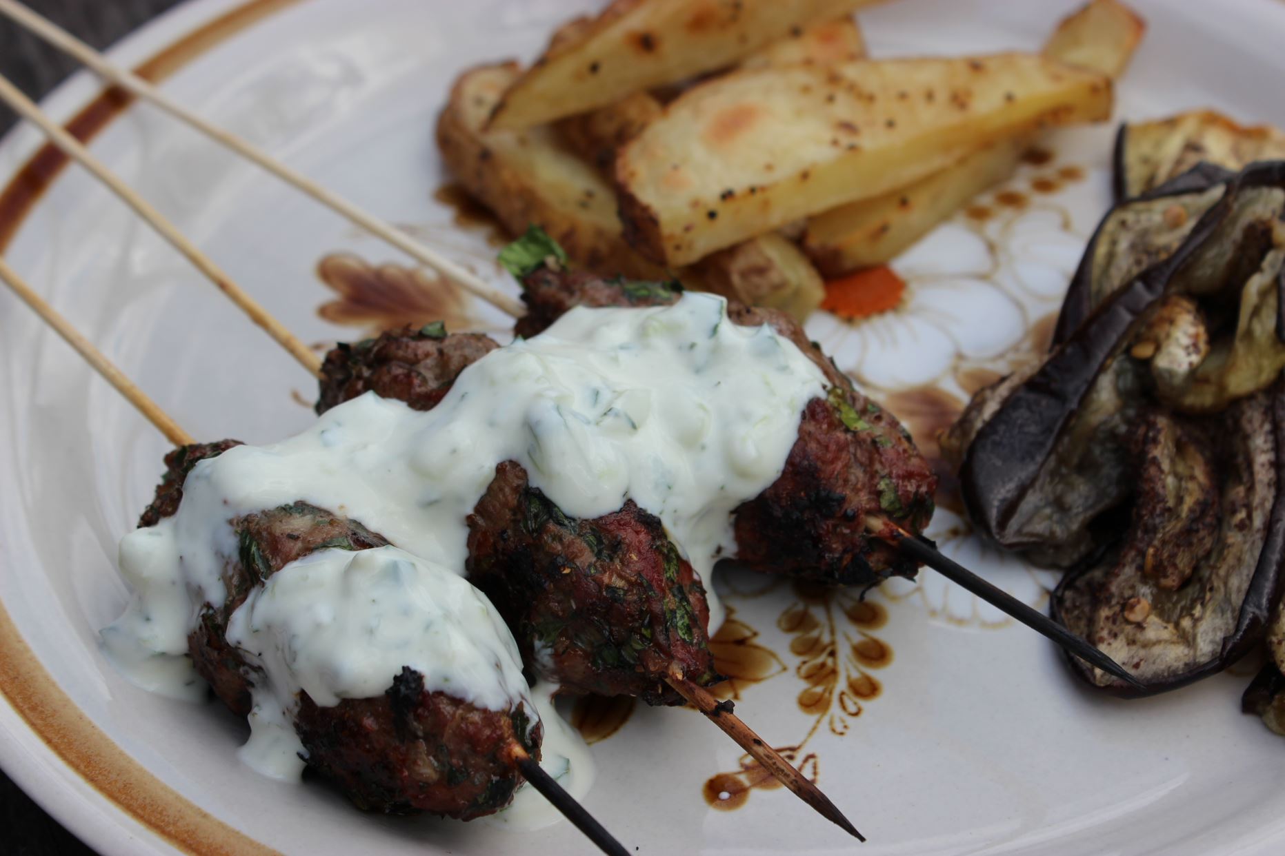 Lamb kofta with roasted potatoes, eggplant and yoghurt dip